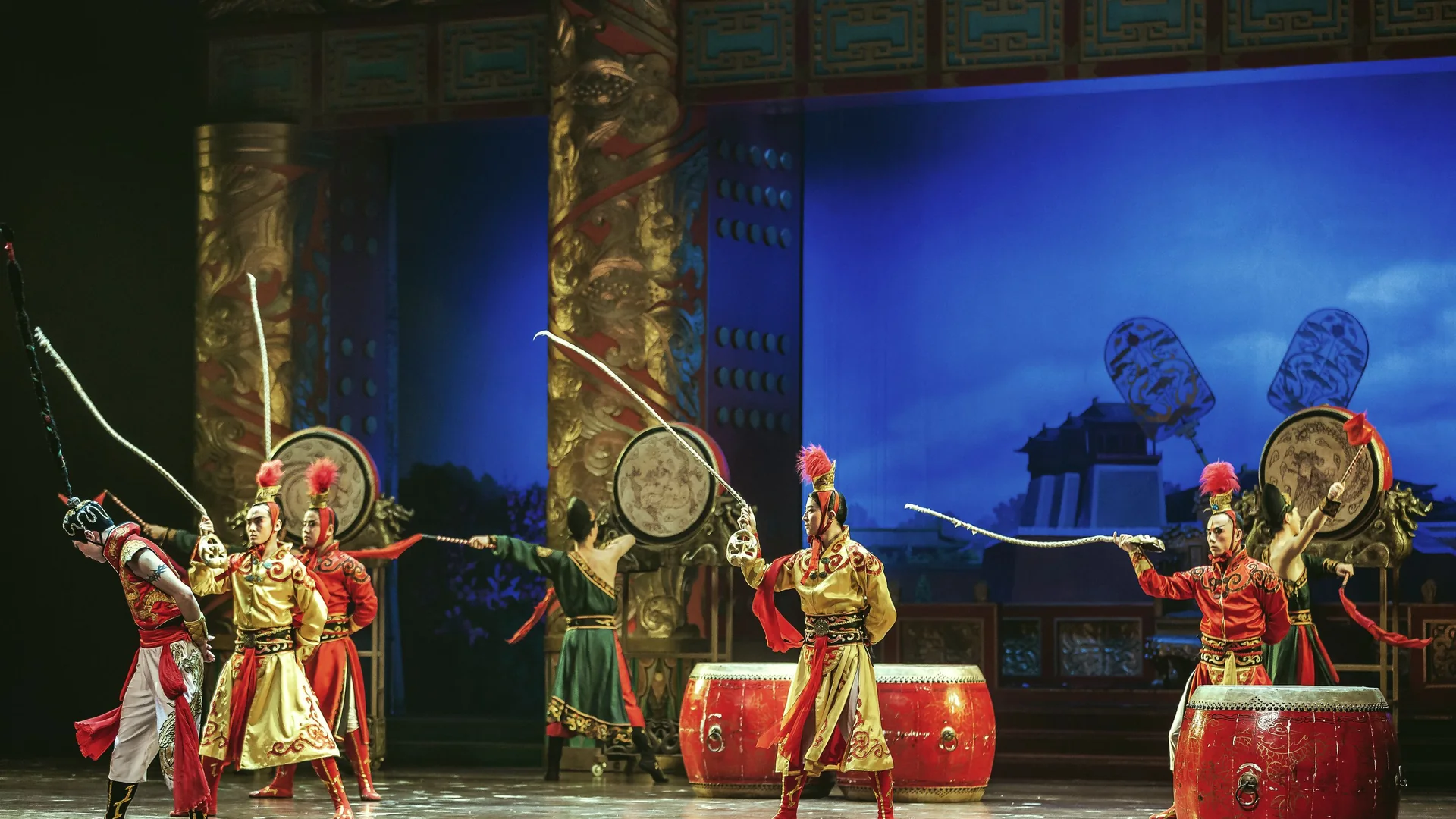 Vibrant large-scale Chinese cultural stage performance with dancers