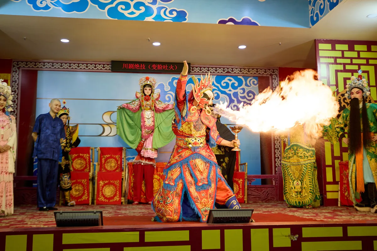 Large-scale Chinese cultural stage performance with dramatic lighting